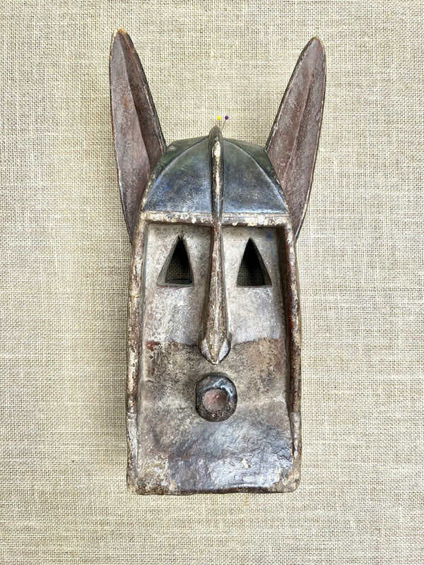 Rare antique Baule hyena mask from Ivory Coast, intricately carved with cultural significance, showcasing exceptional craftsmanship and spiritual symbolism.