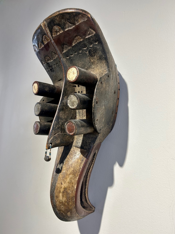 Exquisite Bobo Fing bird mask from Ivory Coast with elegant beak and rich patina, showcasing African art and cultural heritage.