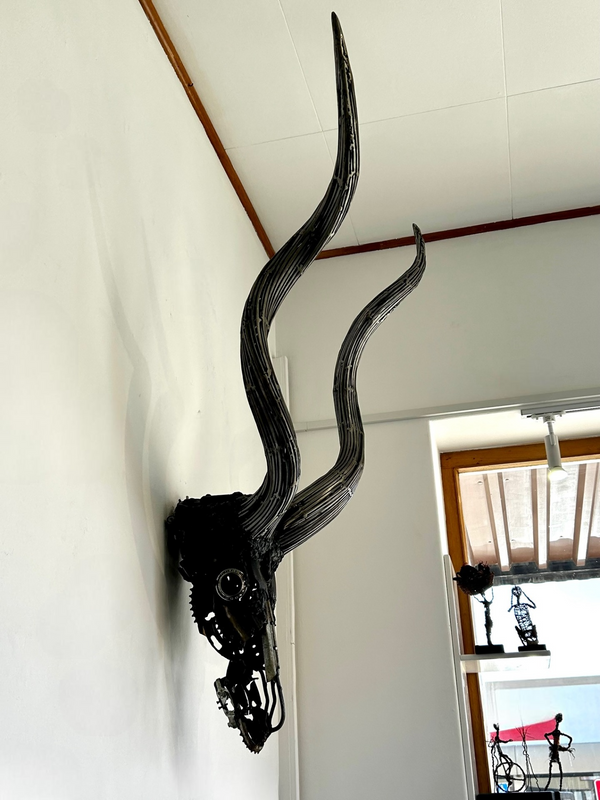 Unique Kudu Trophy sculpture made from upcycled metals, featuring intricate details and lifelike design, displayed in Rogl Souvenirs & Gallery.
