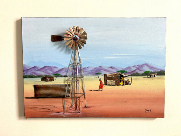 Three-dimensional oil painting of a Namibian rural scene with a traditional wind pump, water basin, and majestic mountains in the background, showcasing the serene beauty of the landscape at Rogl Souvenirs & Gallery.