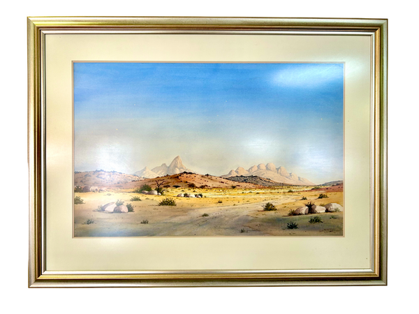 Watercolor painting of Namibian Spitzkoppe landscape by Archie van der Ploeg, featuring granite peaks and rugged terrain in vibrant colors, displayed in a gallery frame.