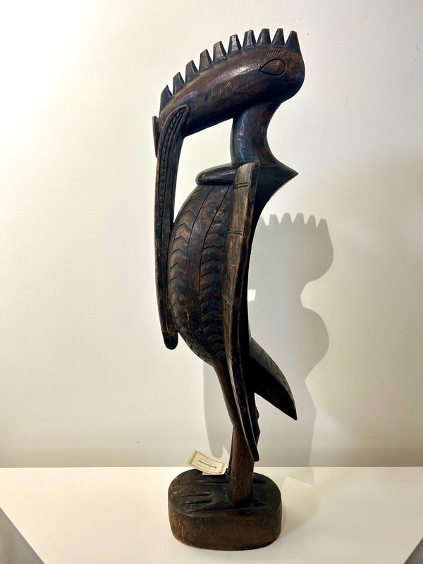 Sejen bird figure sculpture by Senufo artisans from Ivory Coast, showcasing intricate carvings and cultural significance.