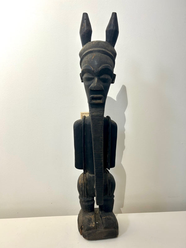 Male Ancestor Figure sculpture from Congo-Zaire, Songye tribe, dark brown, symbolizing wisdom and protection, displayed at Rogl Souvenirs & Gallery.