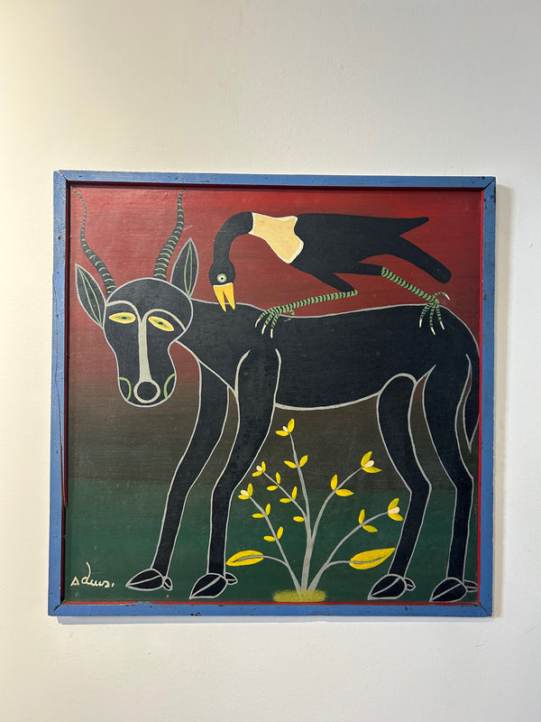 Tingatinga painting by Adeusi Mandu Mmatambwe featuring an antelope and bird in vibrant colors, displayed at Rogl Souvenirs & Gallery.