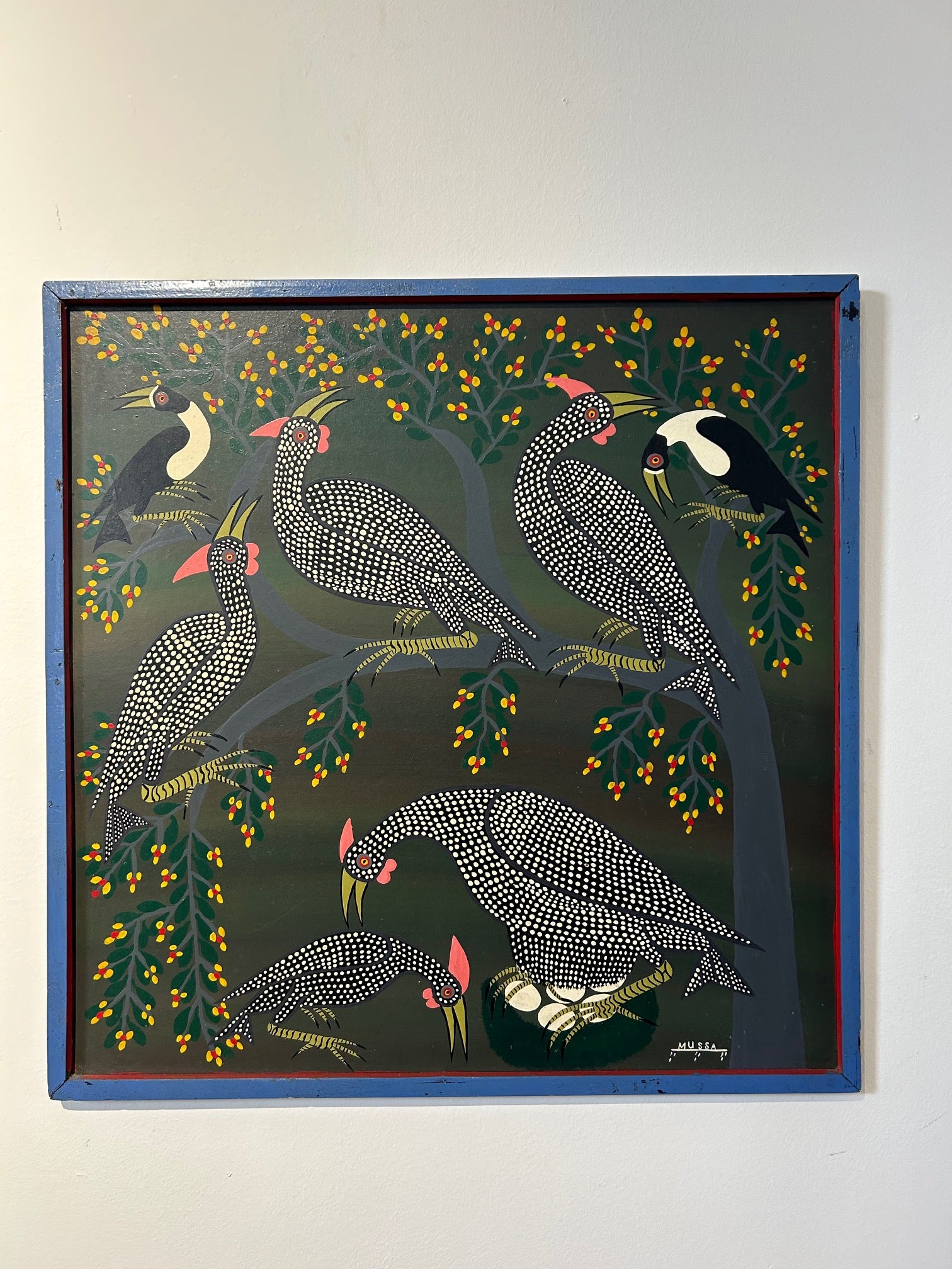 Tingatinga painting of multiple Guinea fowls with one protecting her eggs, showcasing vibrant colors and intricate patterns, available at Rogl Souvenirs & Gallery.